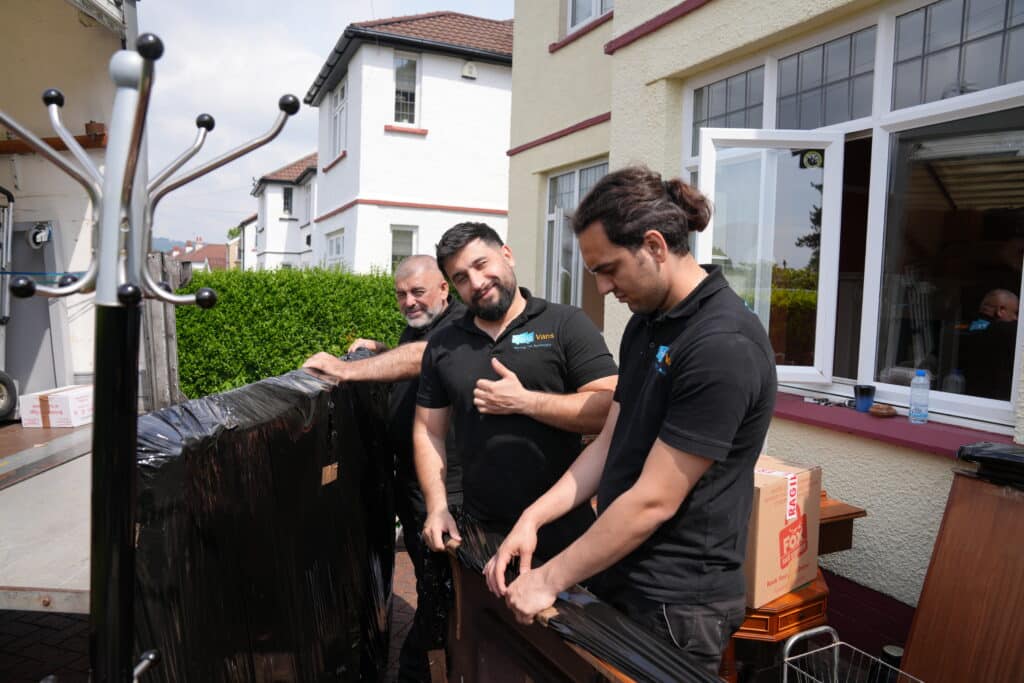 Hello Vans crew loading cleared furniture into a removal van