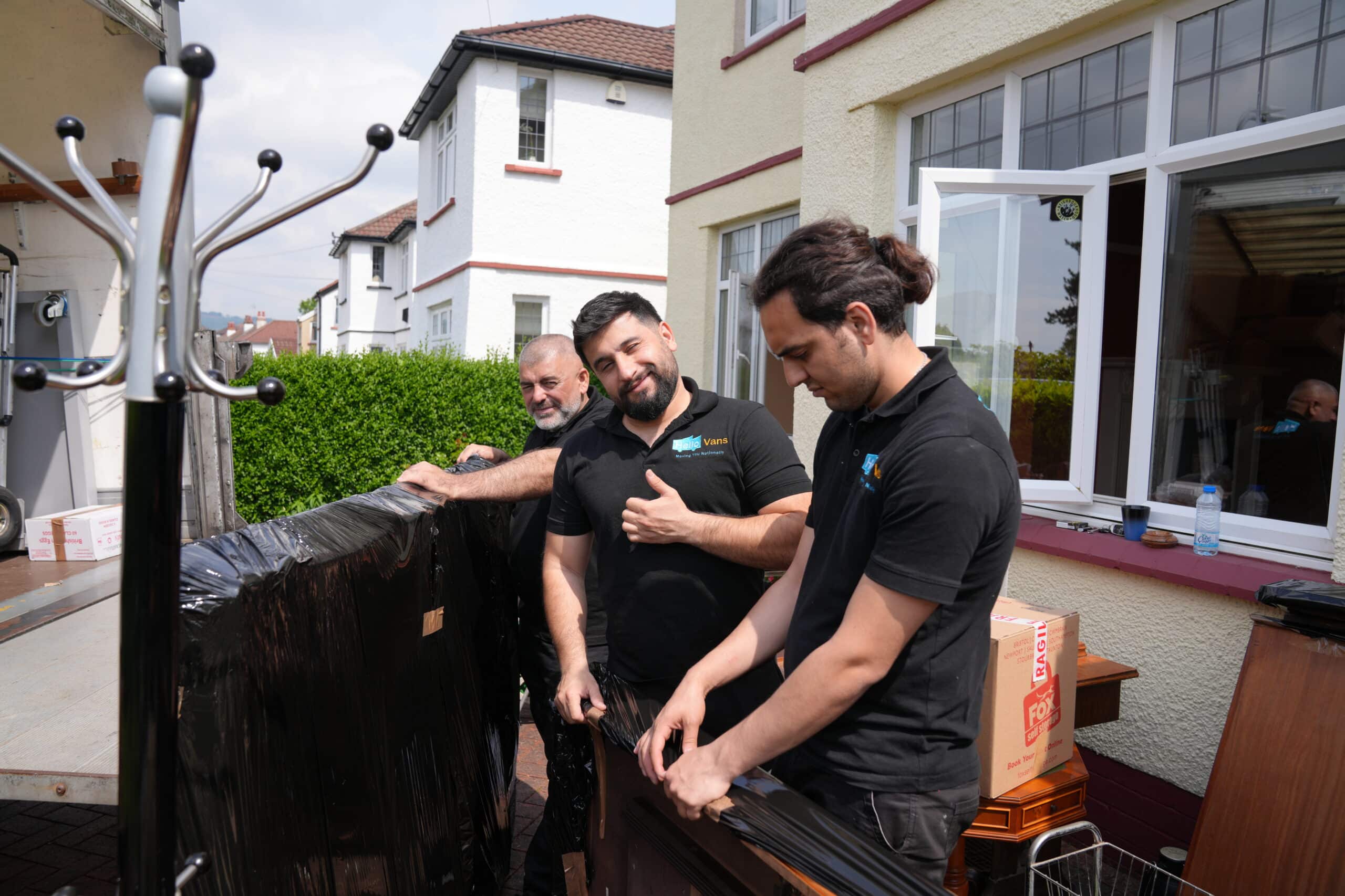 HelloVans professional furniture movers wrapping and loading furniture for a nationwide UK furniture move